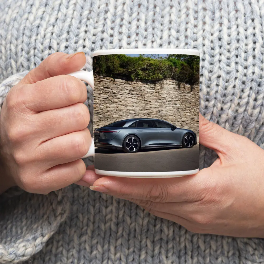 Lucid Air Sedan Parked By Stone Wall – Mugs