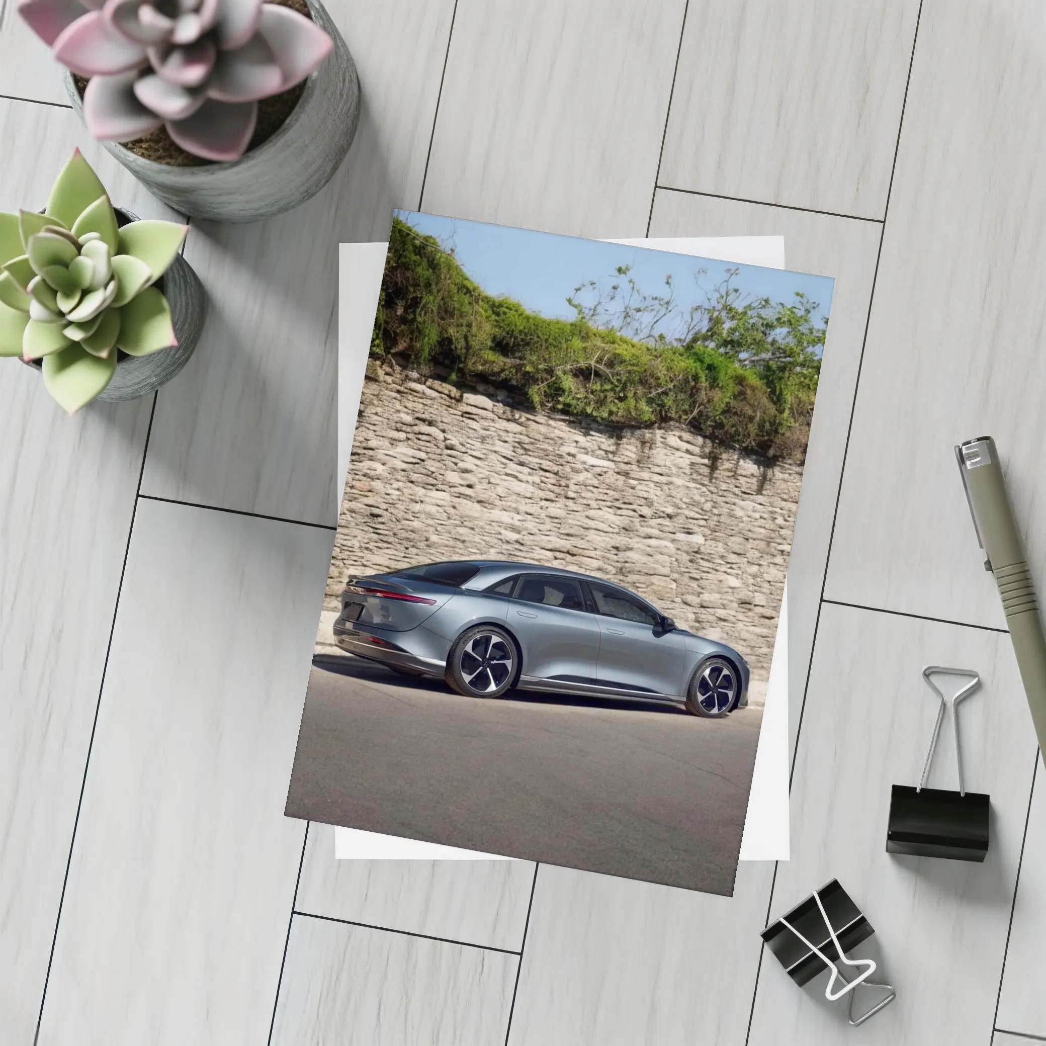 Lucid Air Sedan Parked By Stone Wall – Postcards