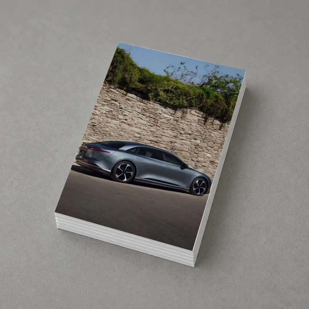 Lucid Air Sedan Parked By Stone Wall – Postcards
