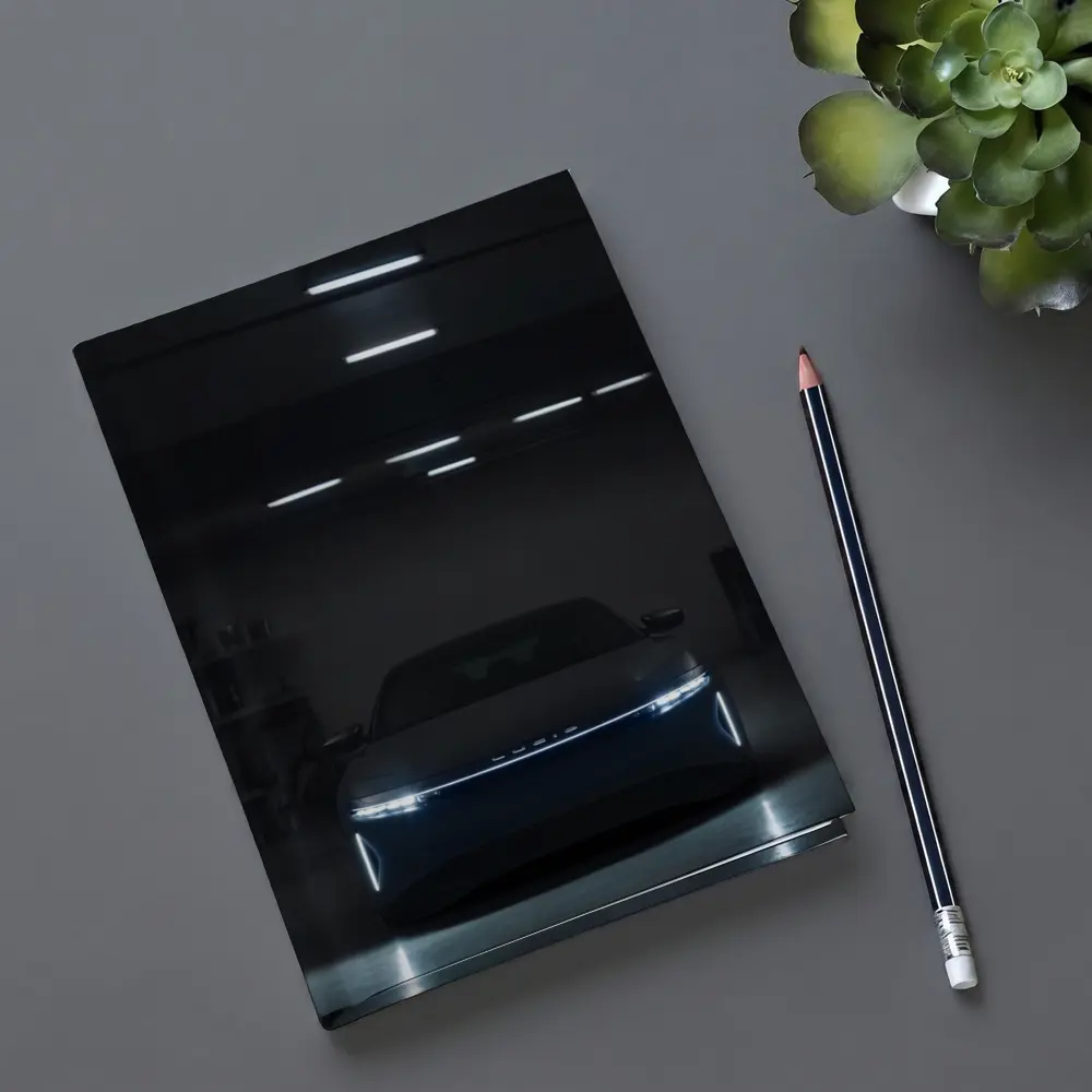 Lucid Air Glowing Headlights Dark Garage – Notebooks