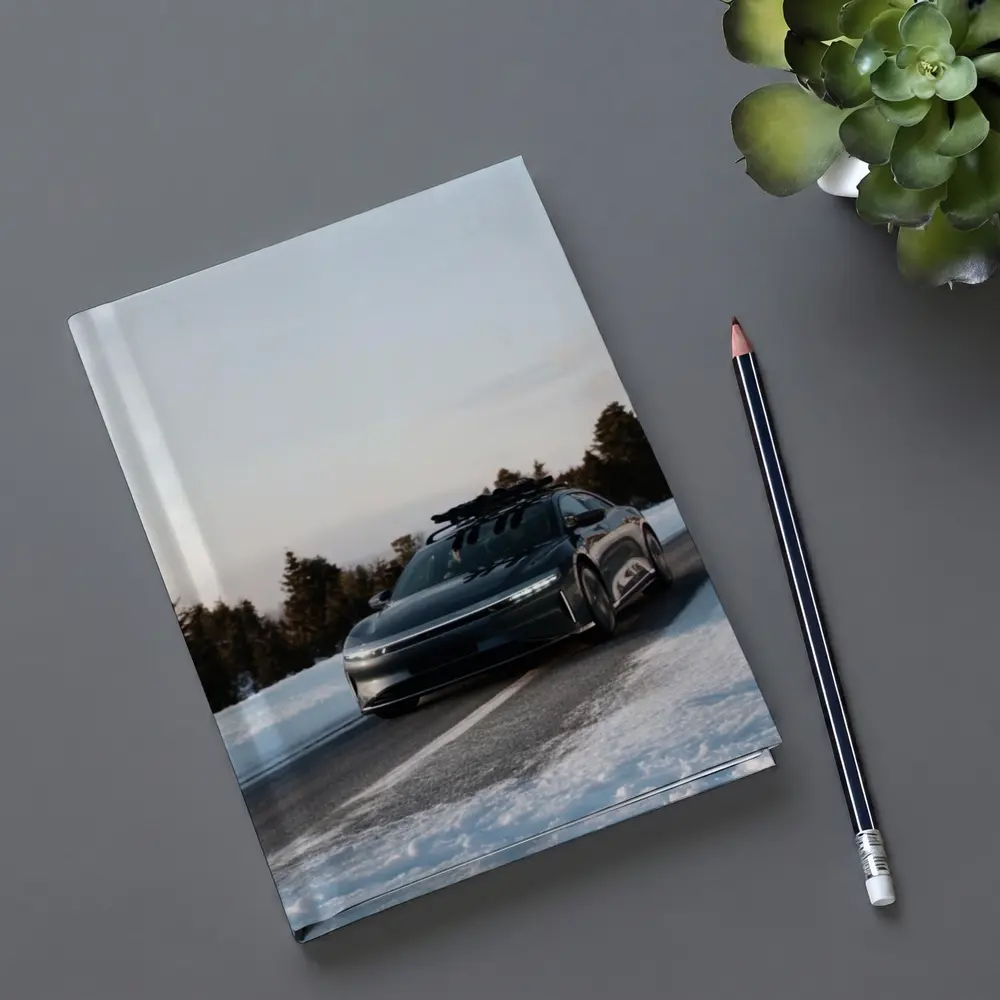 Lucid Air Driving Snowy Winter Road – Notebooks