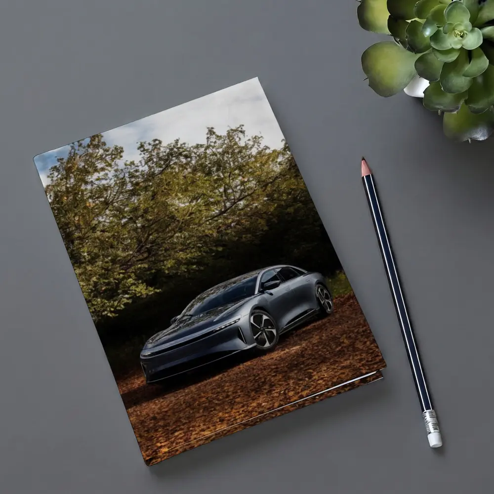 Lucid Air Electric Sedan Autumn Forest Setting – Notebooks