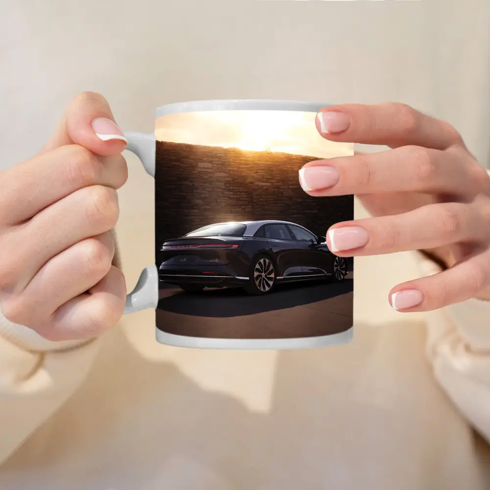 Lucid Air Sedan Parked Against Stone Wall – Mugs
