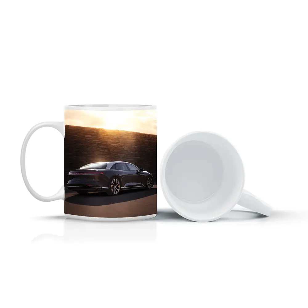 Lucid Air Sedan Parked Against Stone Wall – Mugs