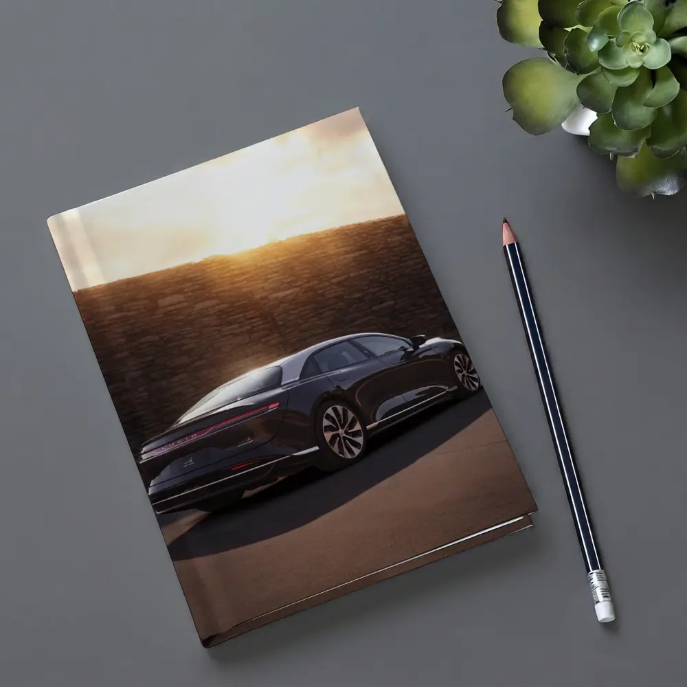 Lucid Air Sedan Parked Against Stone Wall – Notebooks