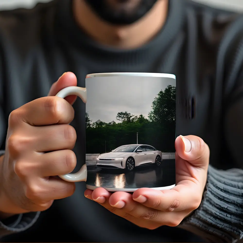 Lucid Air White Sedan Rainy City Street – Mugs