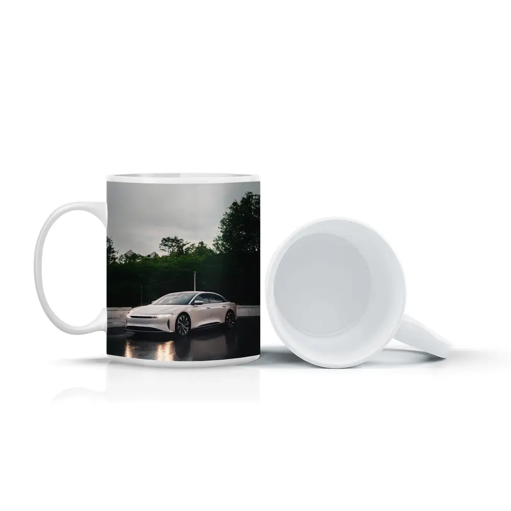 Lucid Air White Sedan Rainy City Street – Mugs