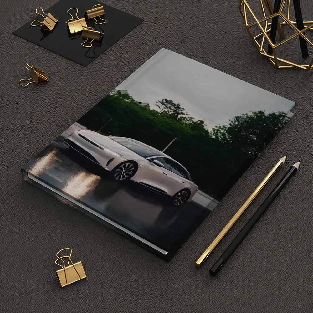 Lucid Air White Sedan Rainy City Street – Notebooks