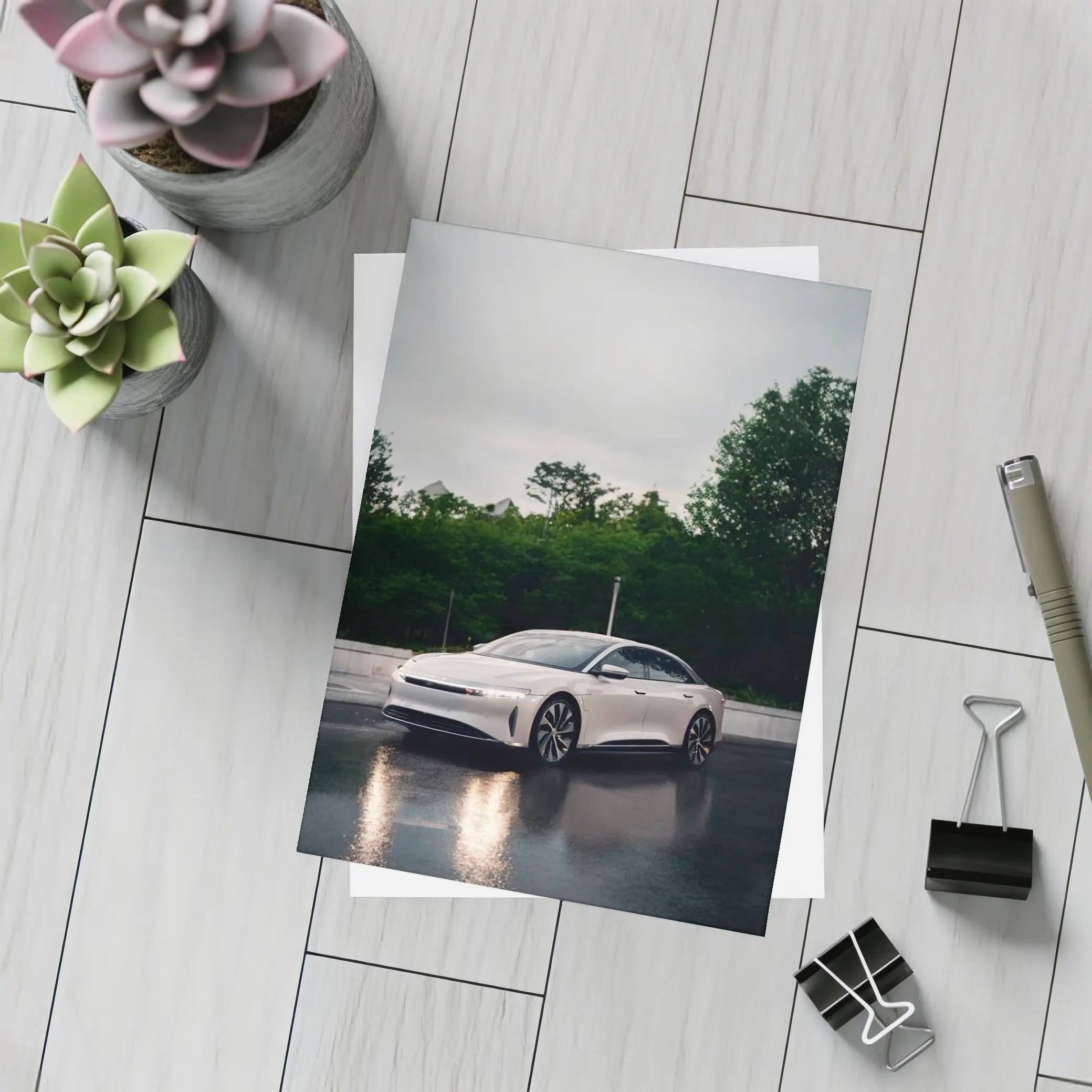 Lucid Air White Sedan Rainy City Street – Postcards