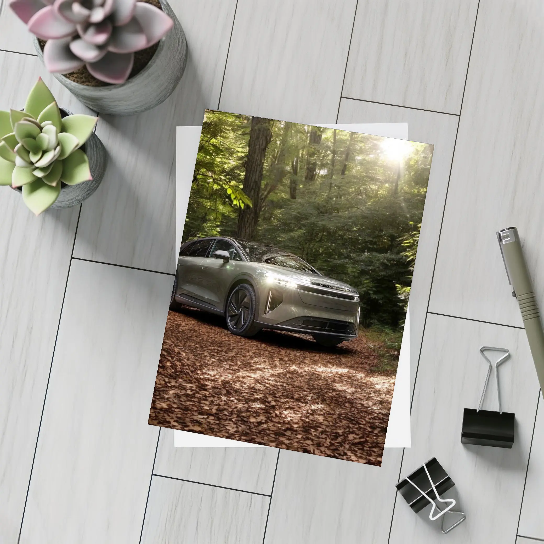 Lucid Gravity SUV Parked In Forest – Postcards