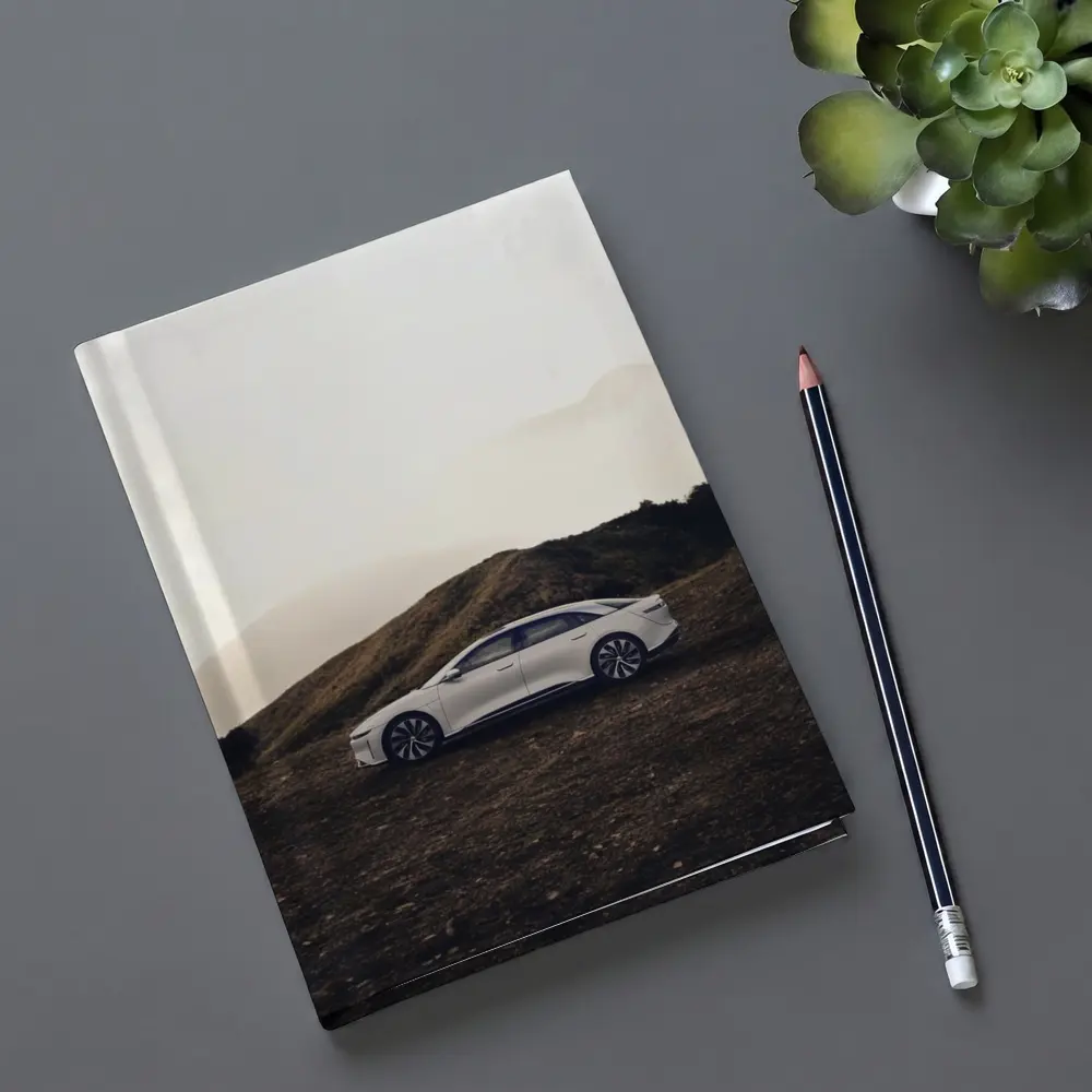 Lucid Air White Sedan Misty Mountain Landscape – Notebooks