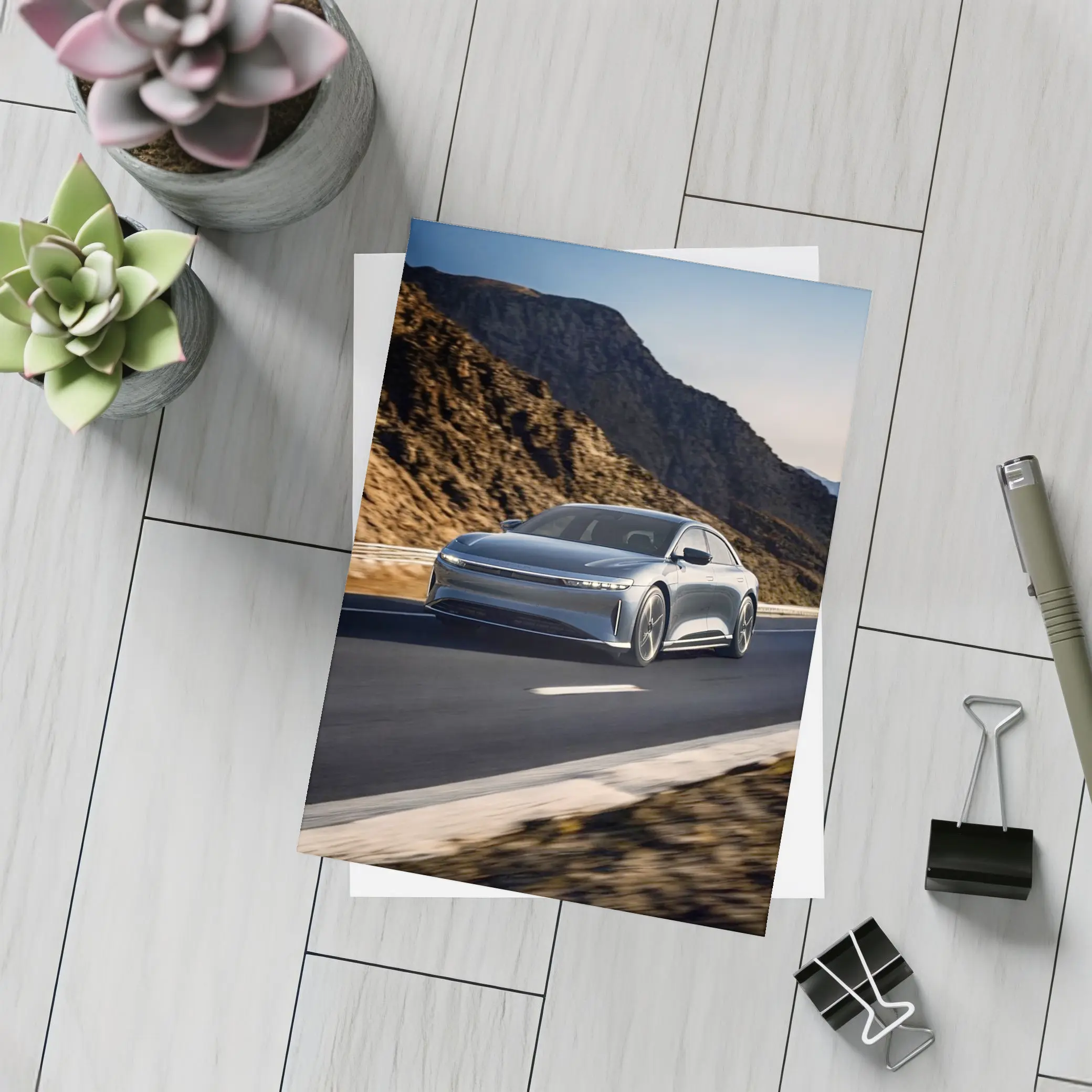 Lucid Air Speeding Through Rocky Mountain Road – Postcards