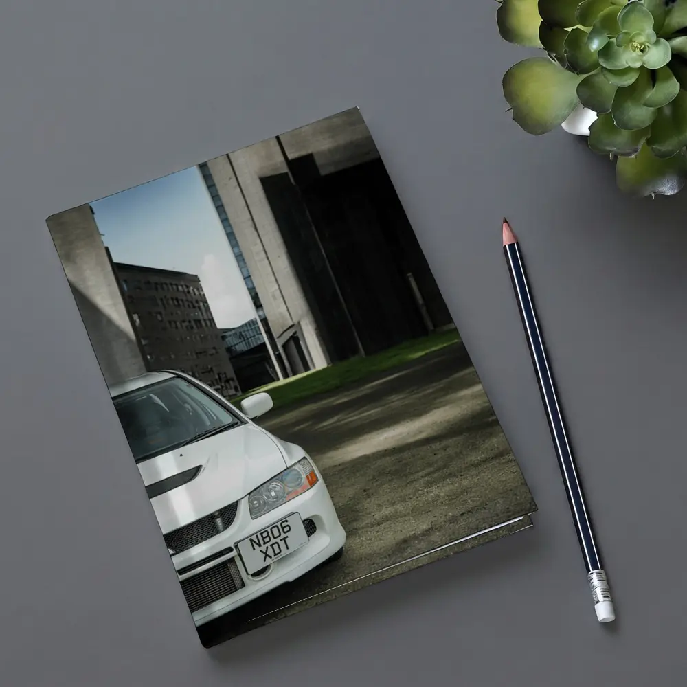 Mitsubishi Lancer Evo White Urban Setting – Notebooks