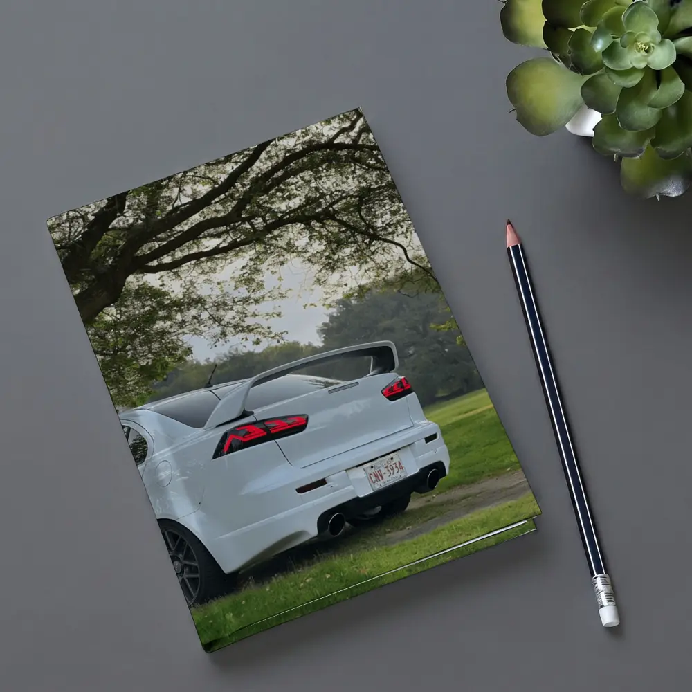 Mitsubishi Lancer White Parked Under Green Trees – Notebooks