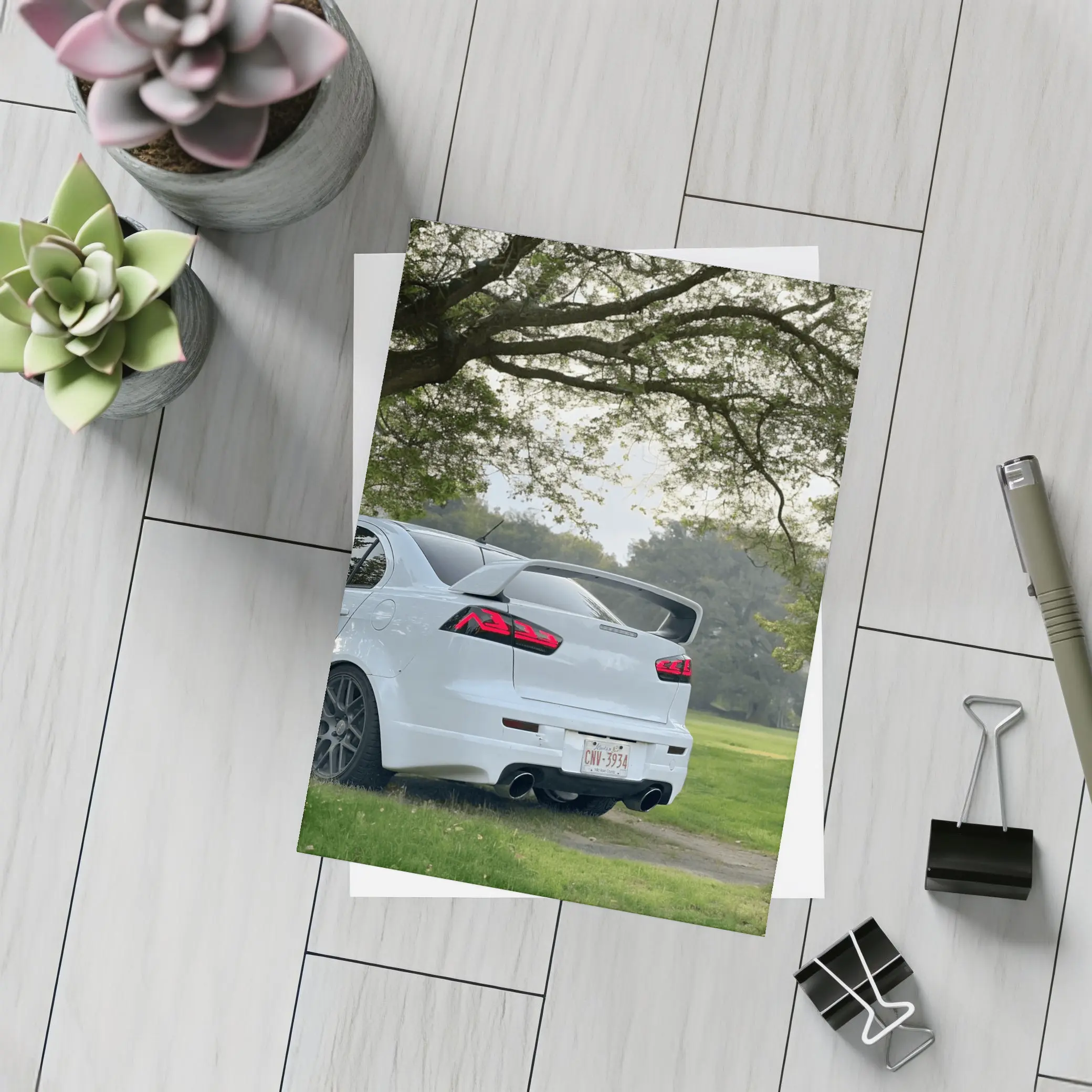 Mitsubishi Lancer White Parked Under Green Trees – Postcards