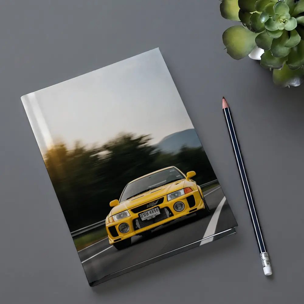 Yellow Mitsubishi Lancer Evolution On Mountain Road – Notebooks