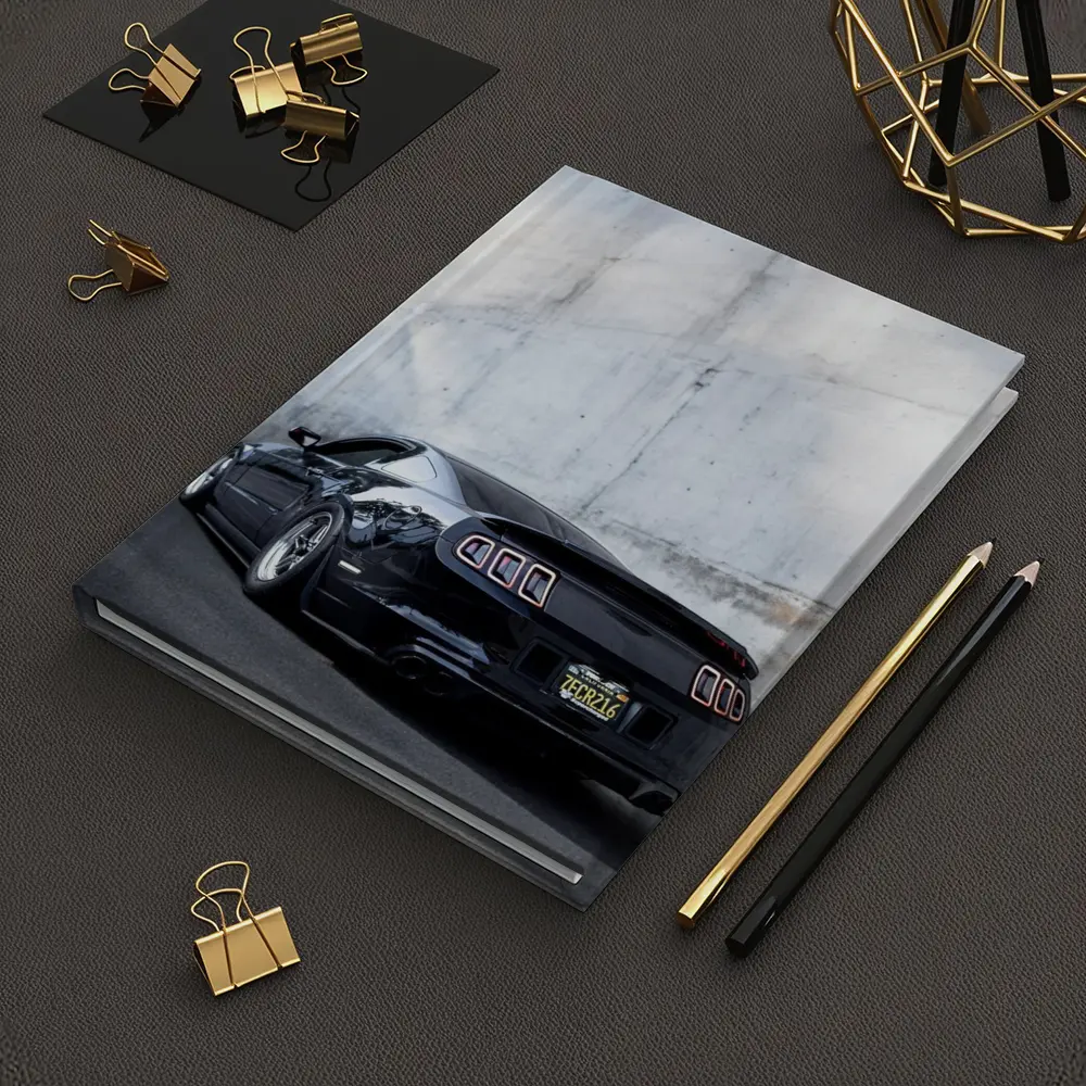 Black Ford Mustang Against Concrete Wall – Notebooks