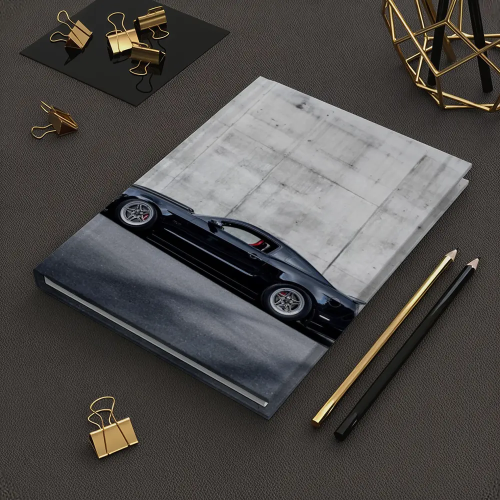 Black Ford Mustang Against Concrete Wall – Notebooks