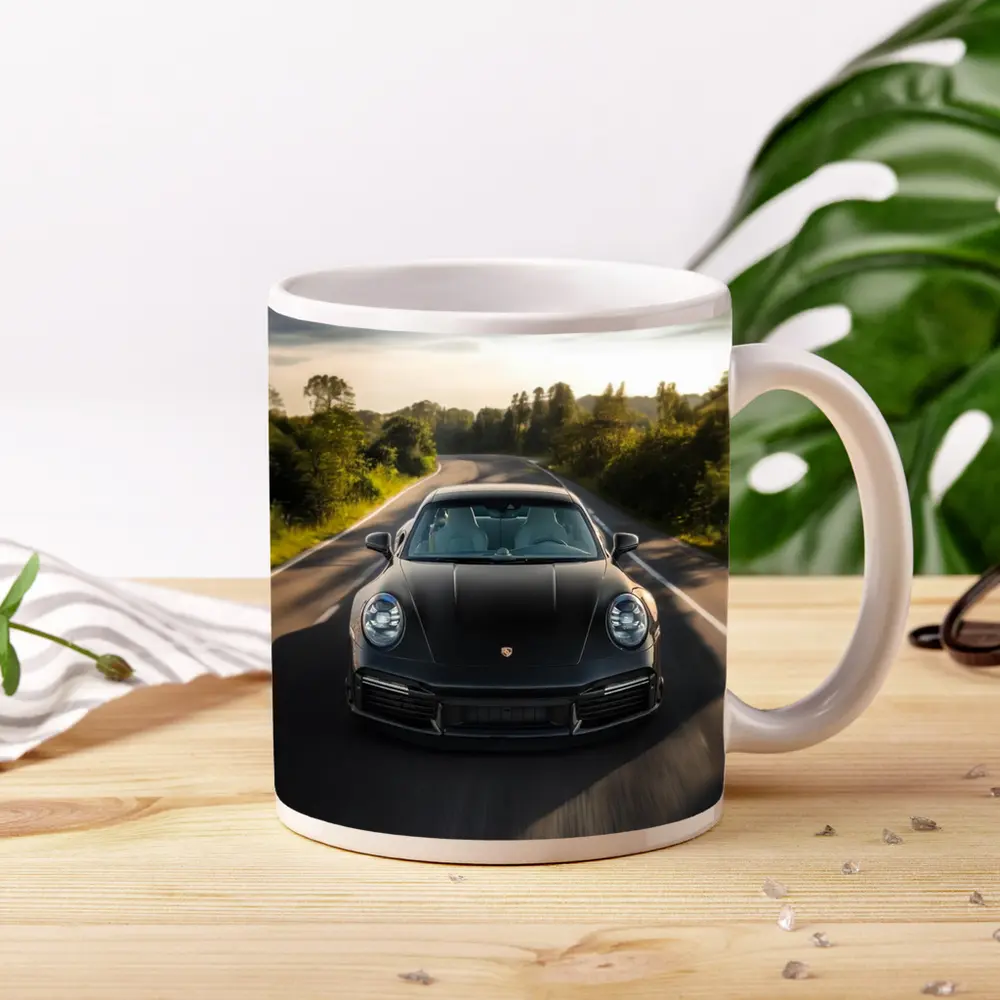 Black Porsche 911 Driving Open Road – Mugs