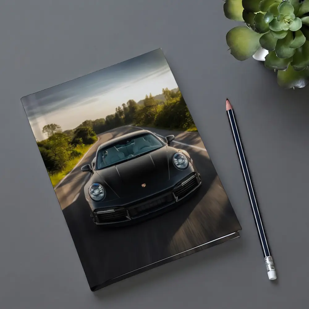 Black Porsche 911 Driving Open Road – Notebooks