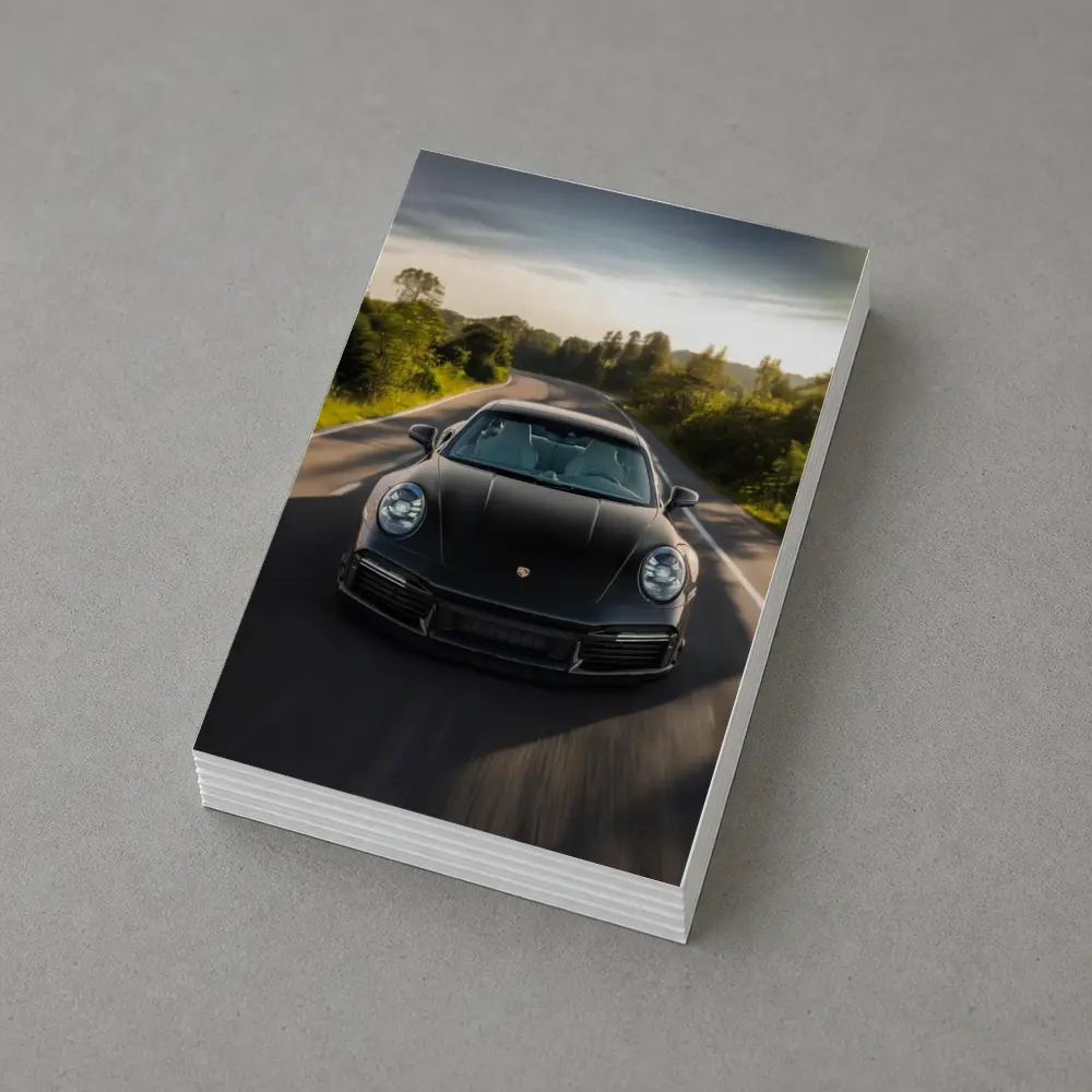 Black Porsche 911 Driving Open Road – Postcards