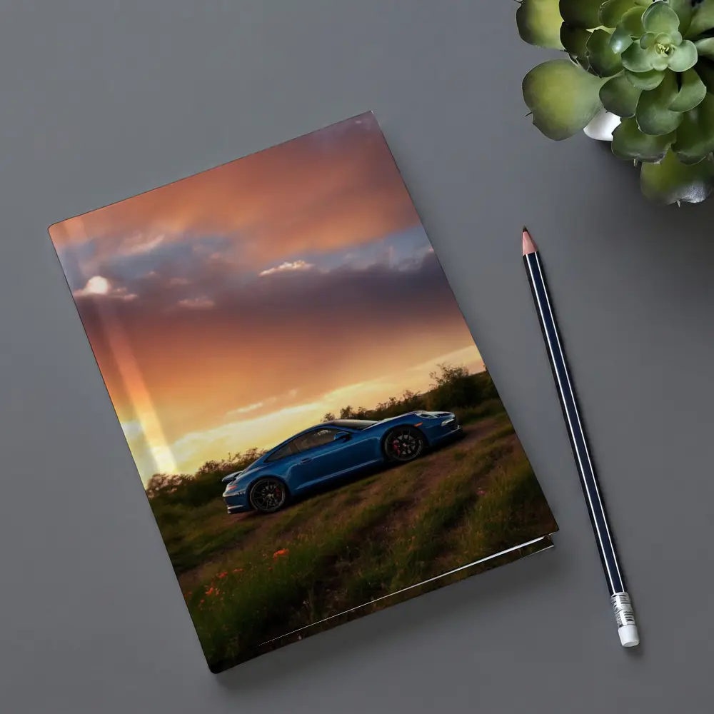 Blue Porsche 911 Parked at Dramatic Sunset – Notebooks