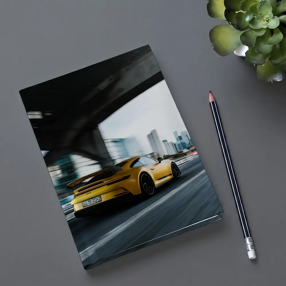 Yellow Porsche GT3 Racing Through City – Notebooks