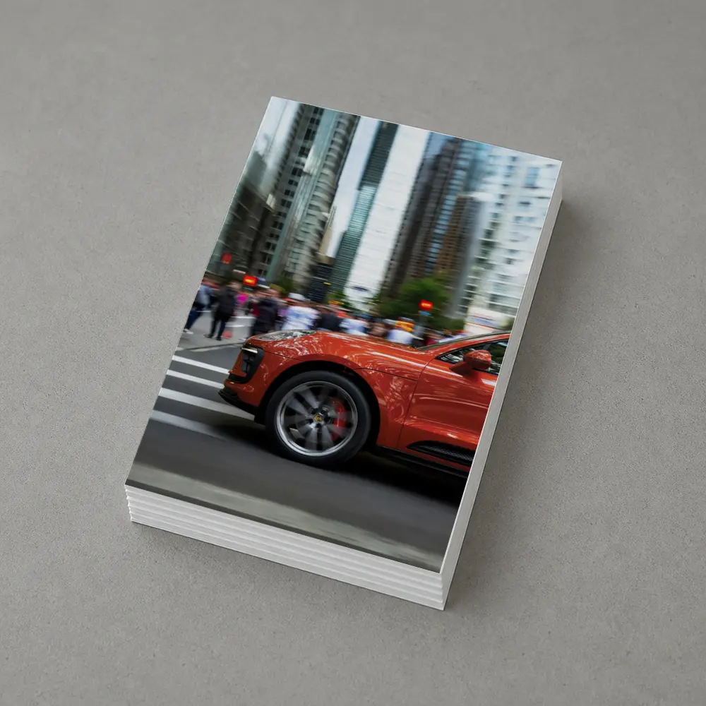 Porsche Macan Orange Speeding Through City Streets – Postcards