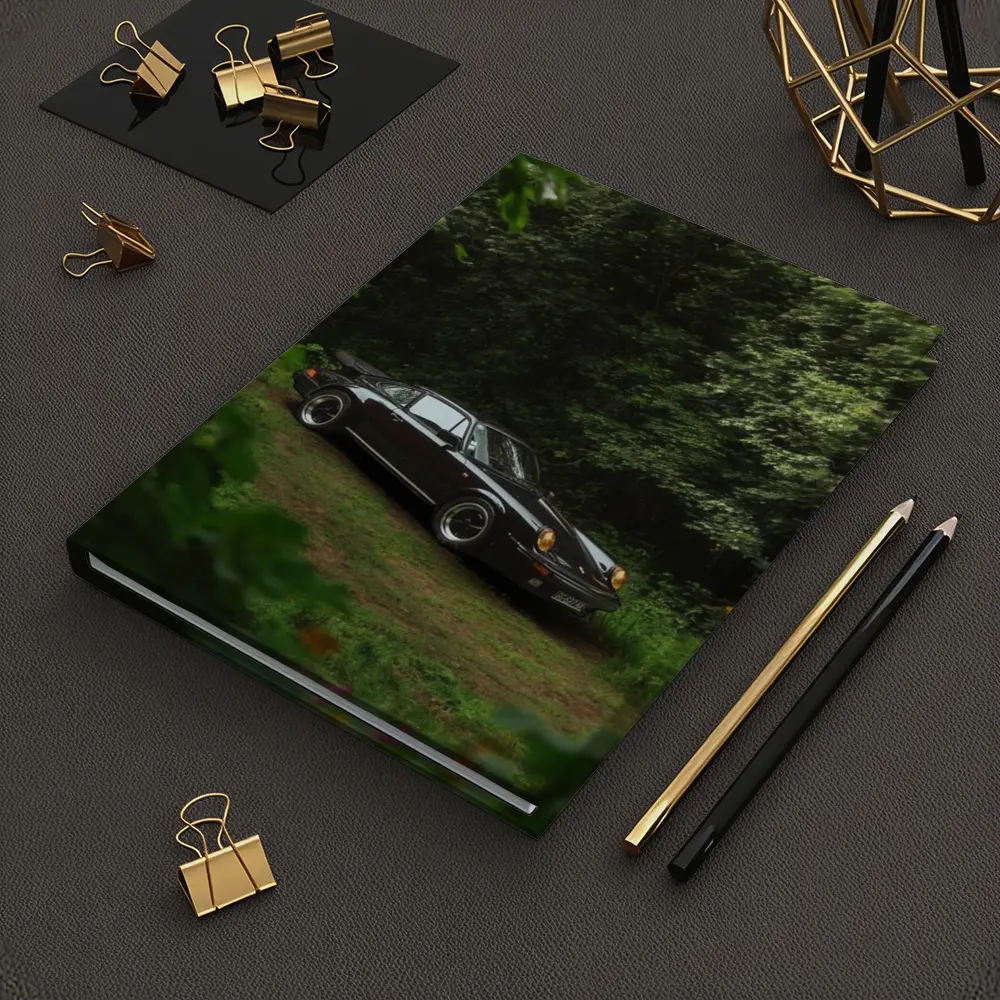 Black Porsche 911 Parked in Green Forest – Notebooks