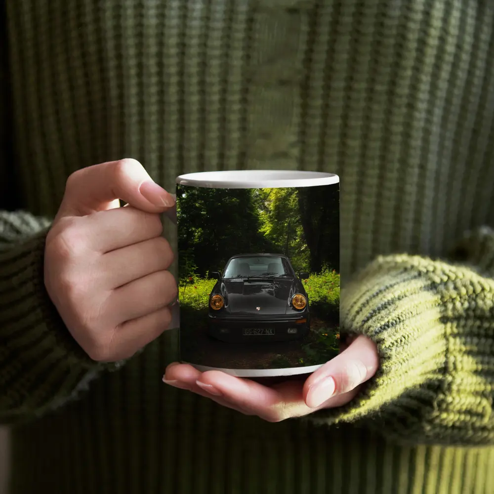 Black Porsche 911 Parked in Green Forest – Mugs