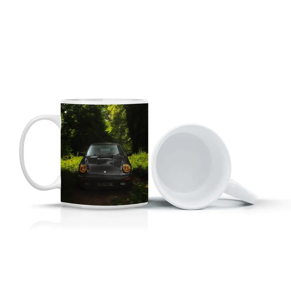 Black Porsche 911 Parked in Green Forest – Mugs