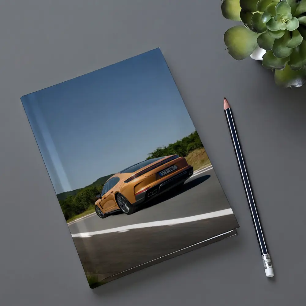 Porsche Panamera Orange On Open Road – Notebooks