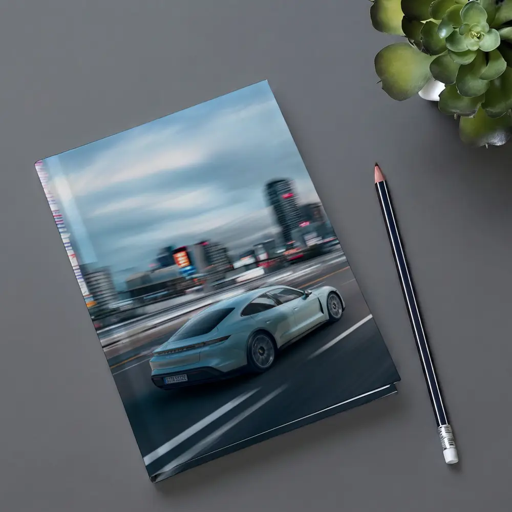 Porsche Taycan Speeding Through City Streets – Notebooks