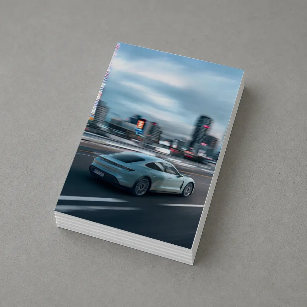 Porsche Taycan Speeding Through City Streets – Postcards