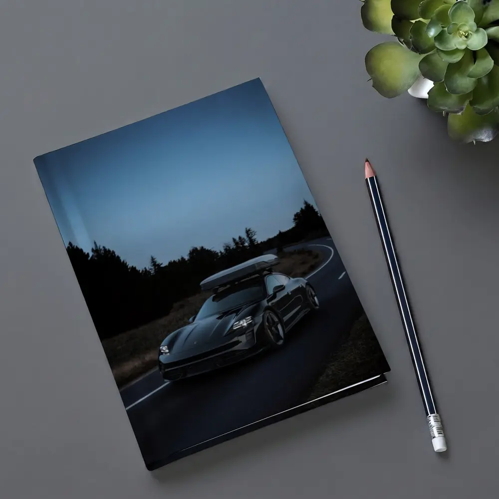 Porsche Taycan on Dark Winding Road – Notebooks