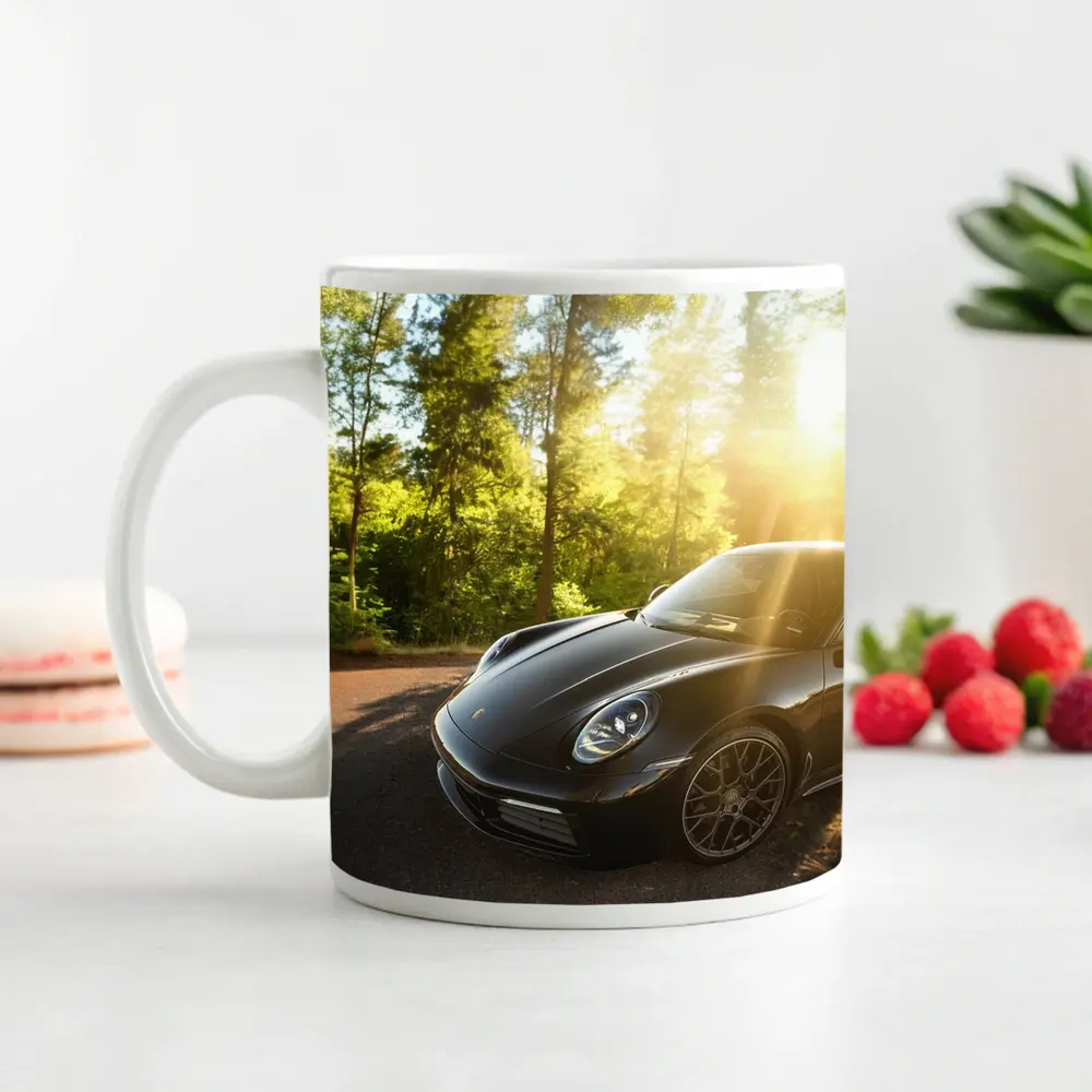 Black Porsche 911 Parked in Sunlit Forest – Mugs
