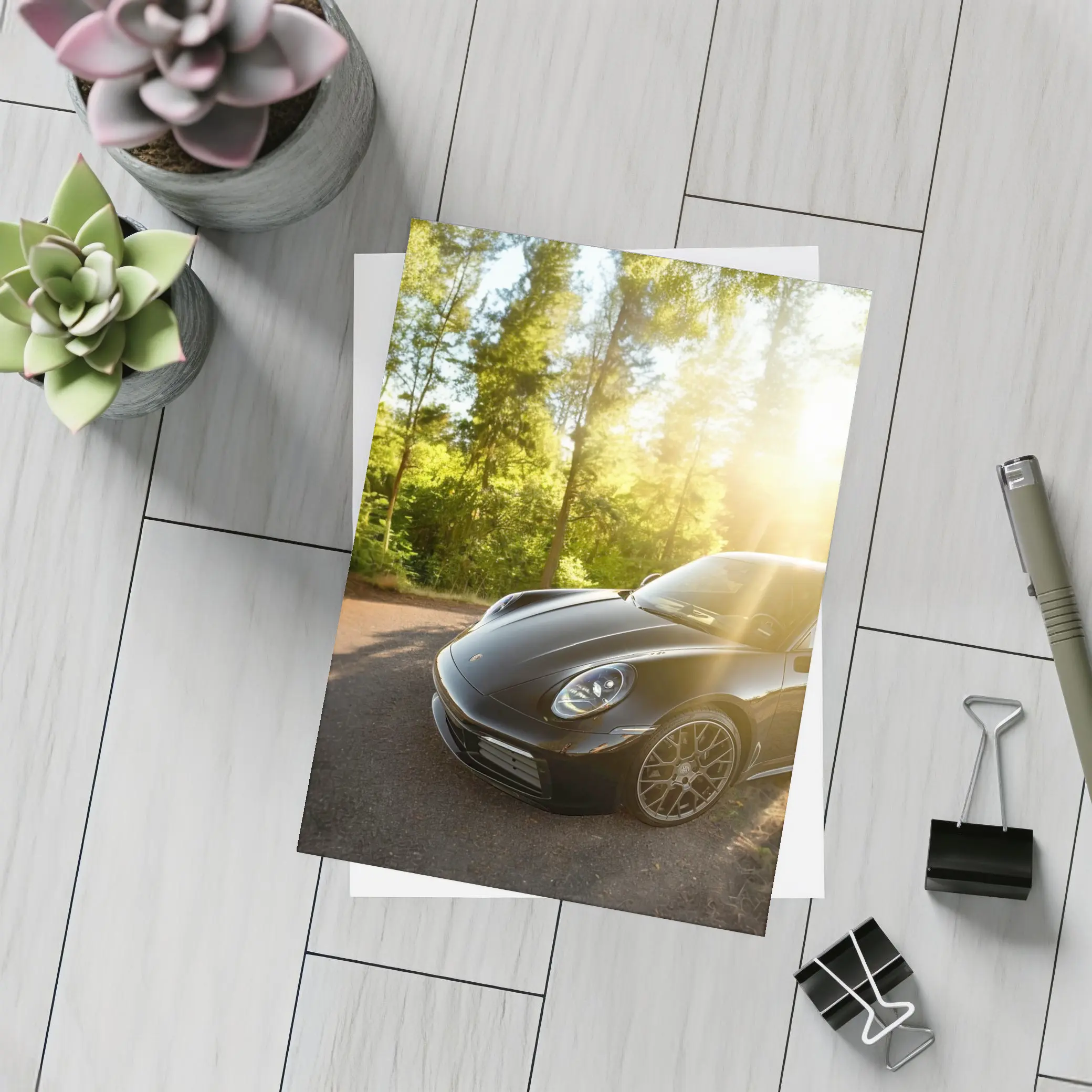 Black Porsche 911 Parked in Sunlit Forest – Postcards