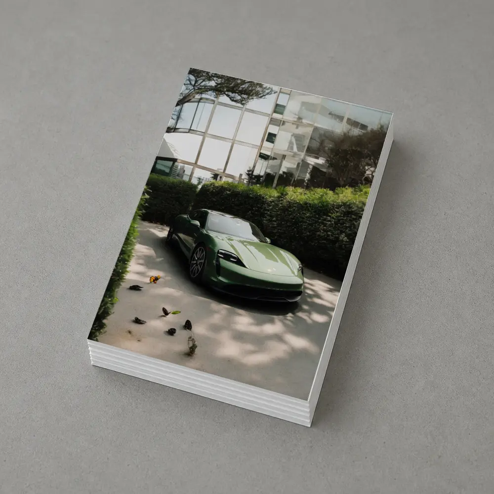 Green Porsche Taycan Parked Near Glass Building – Postcards