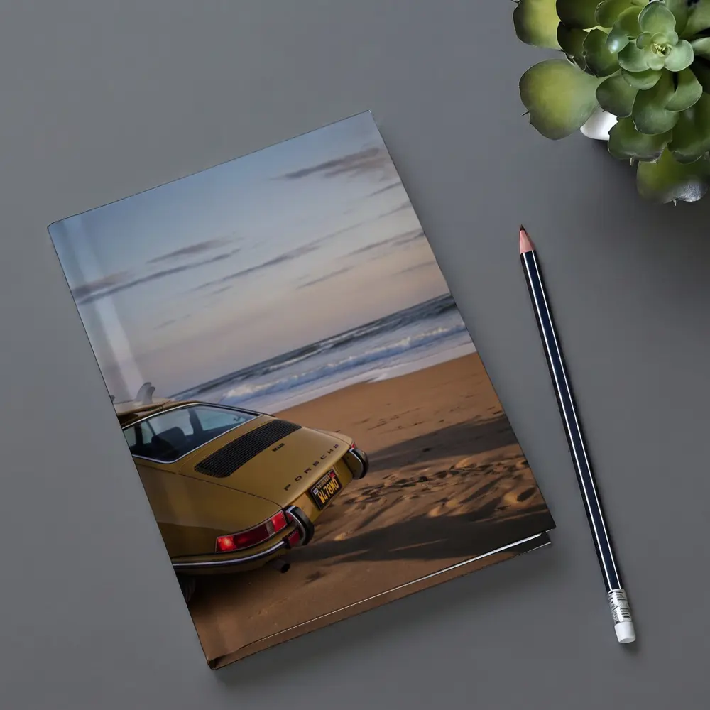 Vintage Porsche 911 Parked On Sandy Beach – Notebooks
