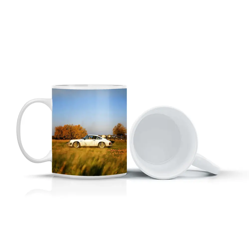 White Porsche 911 Parked in Autumn Field – Mugs