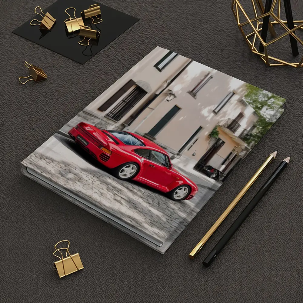 Red Porsche 959 On Cobblestone Old Town Street – Notebooks
