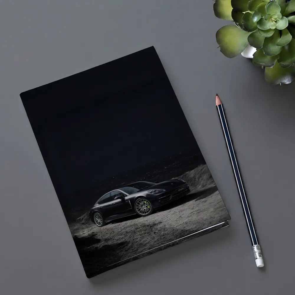Porsche Panamera Parked on Dark Terrain – Notebooks