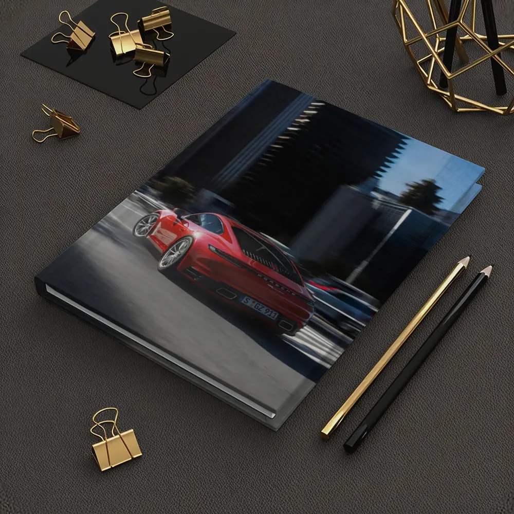 Red Porsche 911 Driving Through City Streets – Notebooks