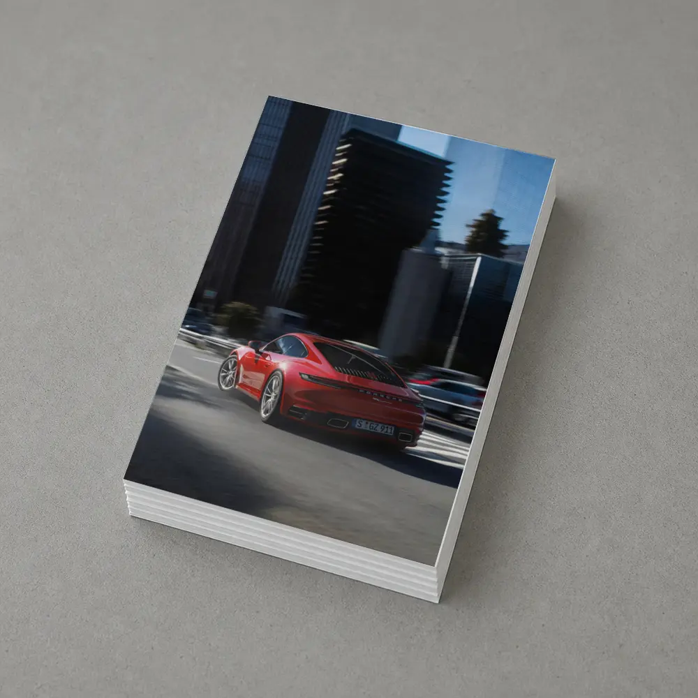 Red Porsche 911 Driving Through City Streets – Postcards