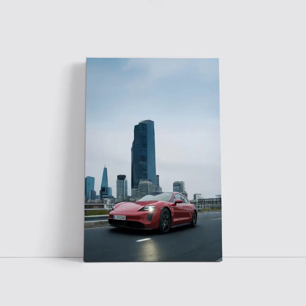 Red Porsche Taycan Driving Through City Skyline – Wall Art