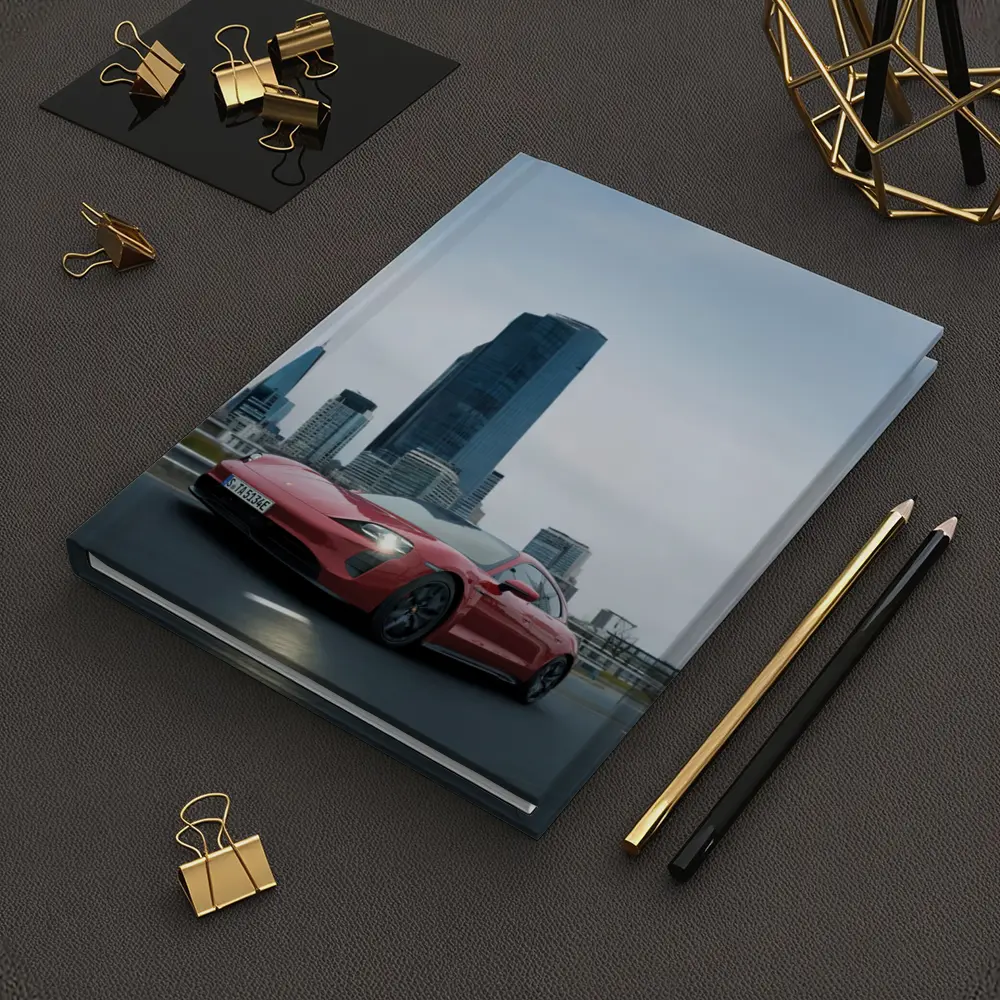 Red Porsche Taycan Driving Through City Skyline – Notebooks