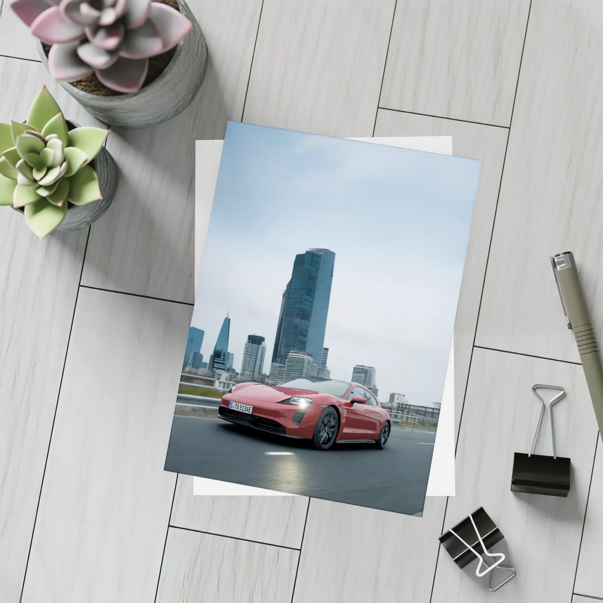 Red Porsche Taycan Driving Through City Skyline – Postcards