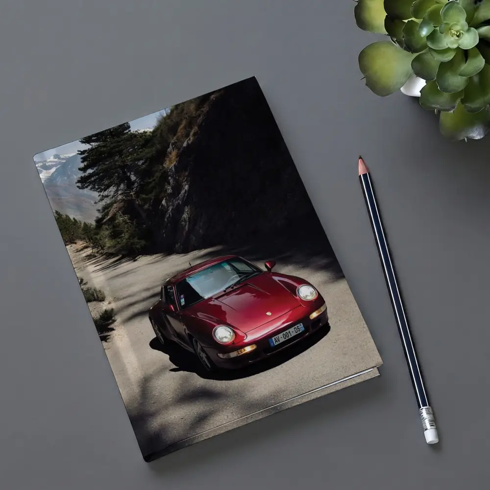 Red Porsche 911 On Alpine Mountain Road – Notebooks