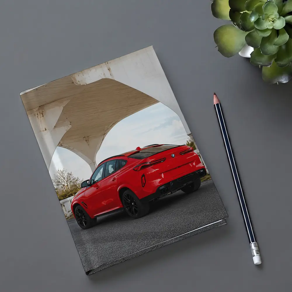 Red BMW X6M Under Concrete Bridge – Notebooks