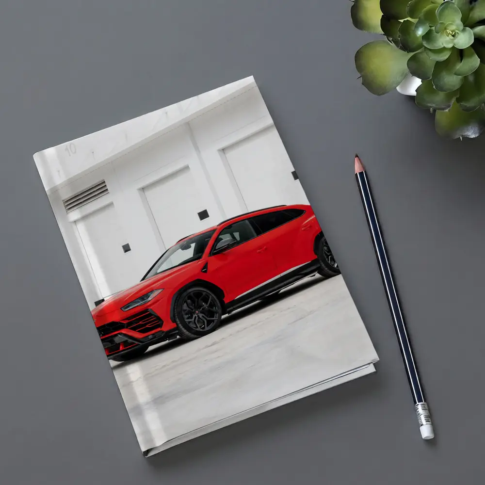 Red Lamborghini Urus Parked Outside Garage – Notebooks